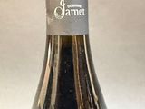 a bottle of wine that is sitting on a table