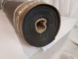 a roll of paper sitting on top of a sheet of paper