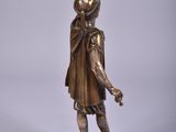 bronze statue of a man with a bird on his head