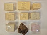 many soap bars, soap bars, and soap bars laid out on a white surface