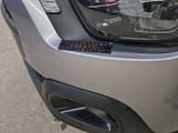 a close up of a car ' s tail light with a sticker on it