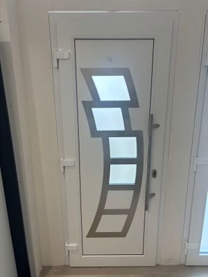 an image of a white door with a glass window