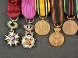 many medals and medals on a black surface