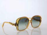 an image of a pair of sunglasses sitting on top of a table