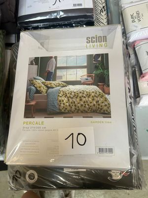 a lot of bedding on display in a store