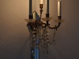 three candles that are lit up on the wall