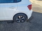 a white car parked on the side of the road