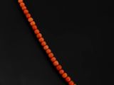 an orange beaded necklace on a mannequin mannequin mannequin mannequin mannequin mannequin mannequin mannequin mann