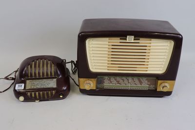an old fashioned radio and a small speaker on a table