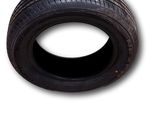 a close up of a tire on a white background