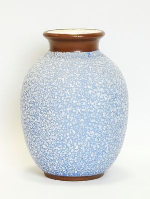 a blue vase with a brown rim on a white background