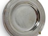 silver plate on a white background with a gold handle