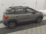 the car is parked in the garage with its roof open