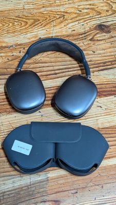 a close up of a pair of headphones on a wooden floor