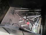 a metal box with a bunch of tools inside of it