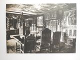 a black and white photo of a dining room