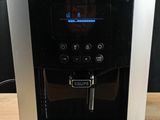 a coffee machine that is sitting on a wooden table