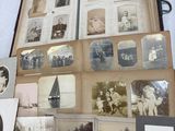a lot of old photos on the table