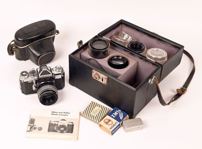 a black case with a camera and other items in it
