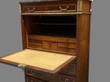 an image of a wooden desk with drawers and a drawer underneath it