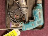 a box with a bunch of tools in it on the floor