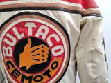 a close up of a jacket with a logo on it