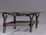 a table with a glass top and metal legs