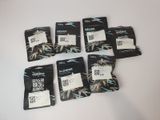 six packets of marijuana flavored tea sit on a white surface