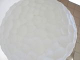 a large white cake sitting on top of a table