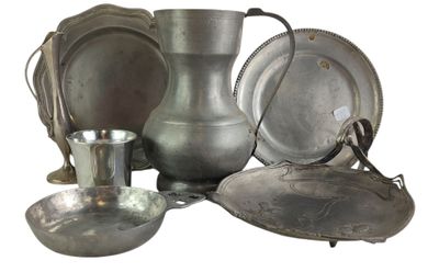 a lot of silver items that are sitting on a table