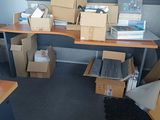 a desk with a lot of boxes and boxes on it