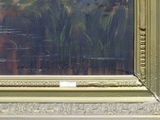 a painting of flowers in a gold frame on the wall