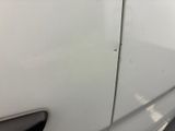 a close up of a car door handle with a sticker on it