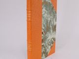 an orange book with a picture of a dog on the cover