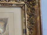 a picture of a cat that is sitting in a picture frame