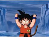 une image représentant un jeune Gohan, les bras levés