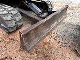 a bulldozer that is sitting in the dirt