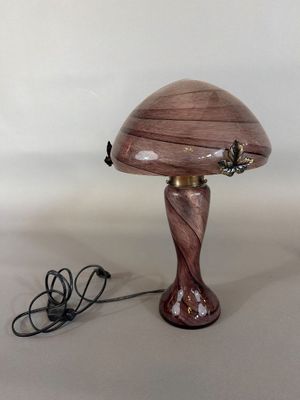 purple glass table lamp with a wooden base and a butterfly on the top