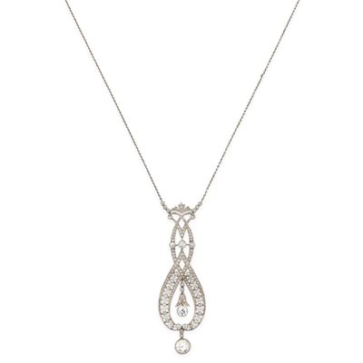 a white gold and diamond necklace with a tear shaped pendant