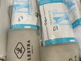 many rolls of toilet paper wrapped in plastic bags