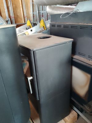 a black stove and a black oven in a room