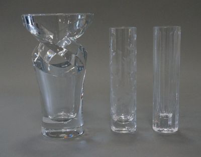 three glass vases sitting next to each other on a table
