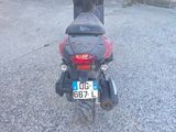 a scooter that is parked in a parking lot