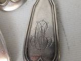 three spoons that are sitting on a table