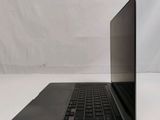an open laptop computer sitting on top of a white table