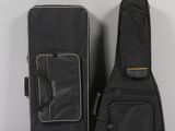 a guitar case and a guitar bag sitting on a table