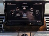 a car dashboard with a radio and a clock on it