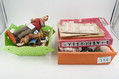 two baskets with toys in them sitting on a table