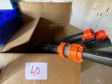 a plastic gun that is sitting on top of a cardboard box