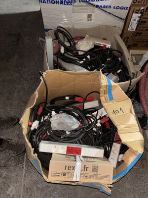 a box full of wires and wires sitting on the floor